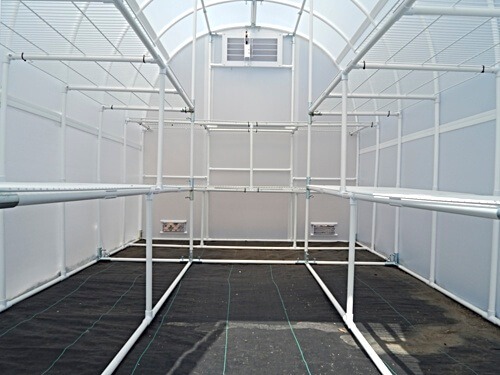 Interior view of shelving configuration in the Solexx Gardener's Oasis greenhouse